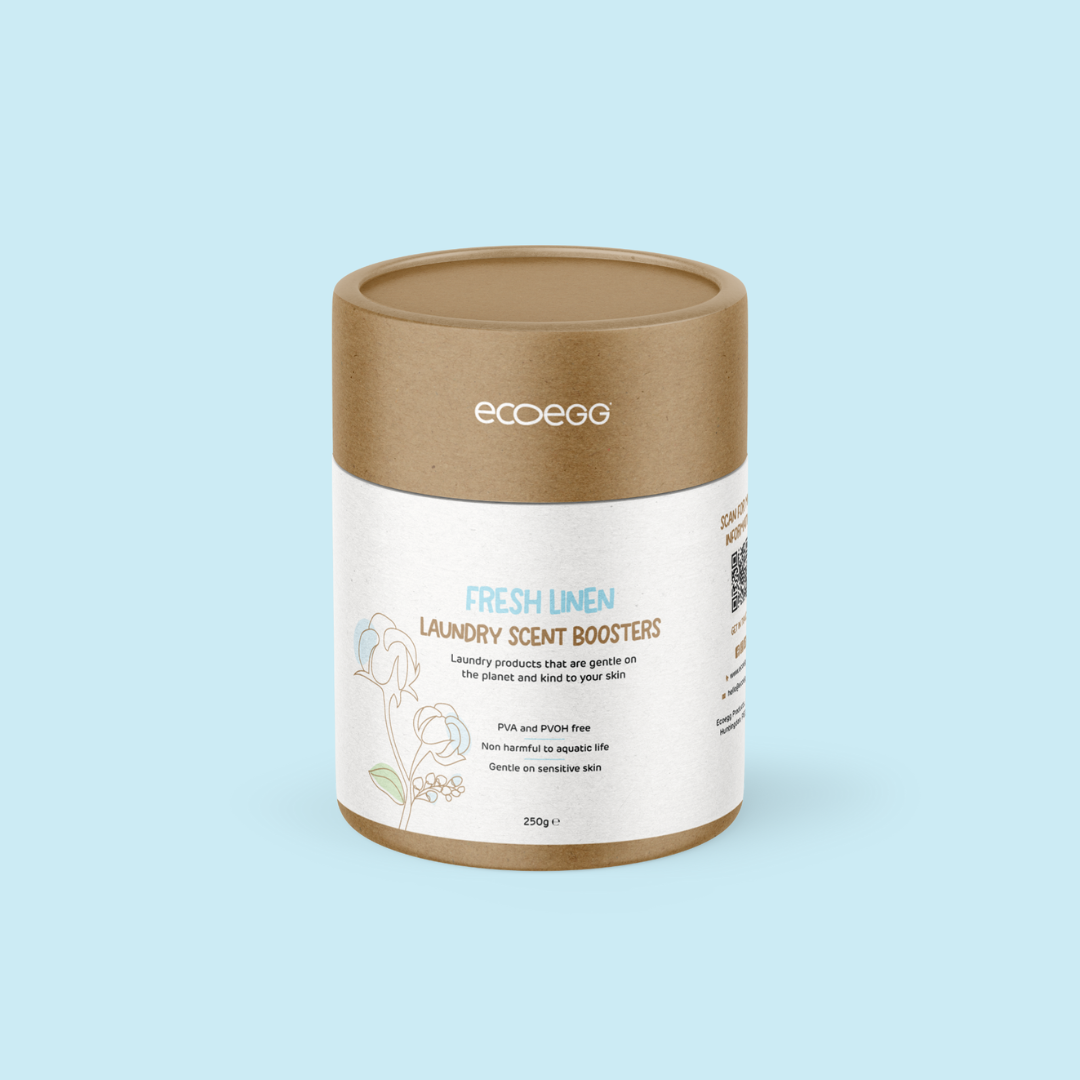 Container of ecoego Fresh Linen laundry scent boosters on a light blue background
